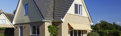 Vrijstaande vakantiewoning met een nette tuin en zonnescherm op vakantiepark Landal Vogelmient, dicht bij de Koog op Texel.