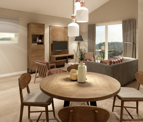 De moderne en sfeervol ingerichte woonkamer van een appartement op Landal Arber, met een houten eettafel en een gezellige zithoek.