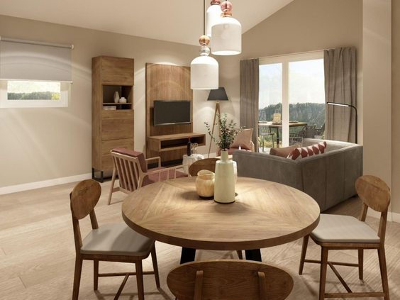 De moderne en sfeervol ingerichte woonkamer van een appartement op Landal Arber, met een houten eettafel en een gezellige zithoek.