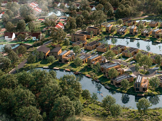 Luchtfoto van vakantiepark Landal De Wedderplassen, met de vakantiehuizen gelegen tussen het groen en aan het water.