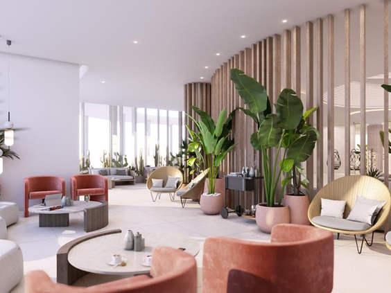 De stijlvolle en moderne lobby en lounge van Parque Cristobal met comfortabele design stoelen en een frisse, botanische inrichting.